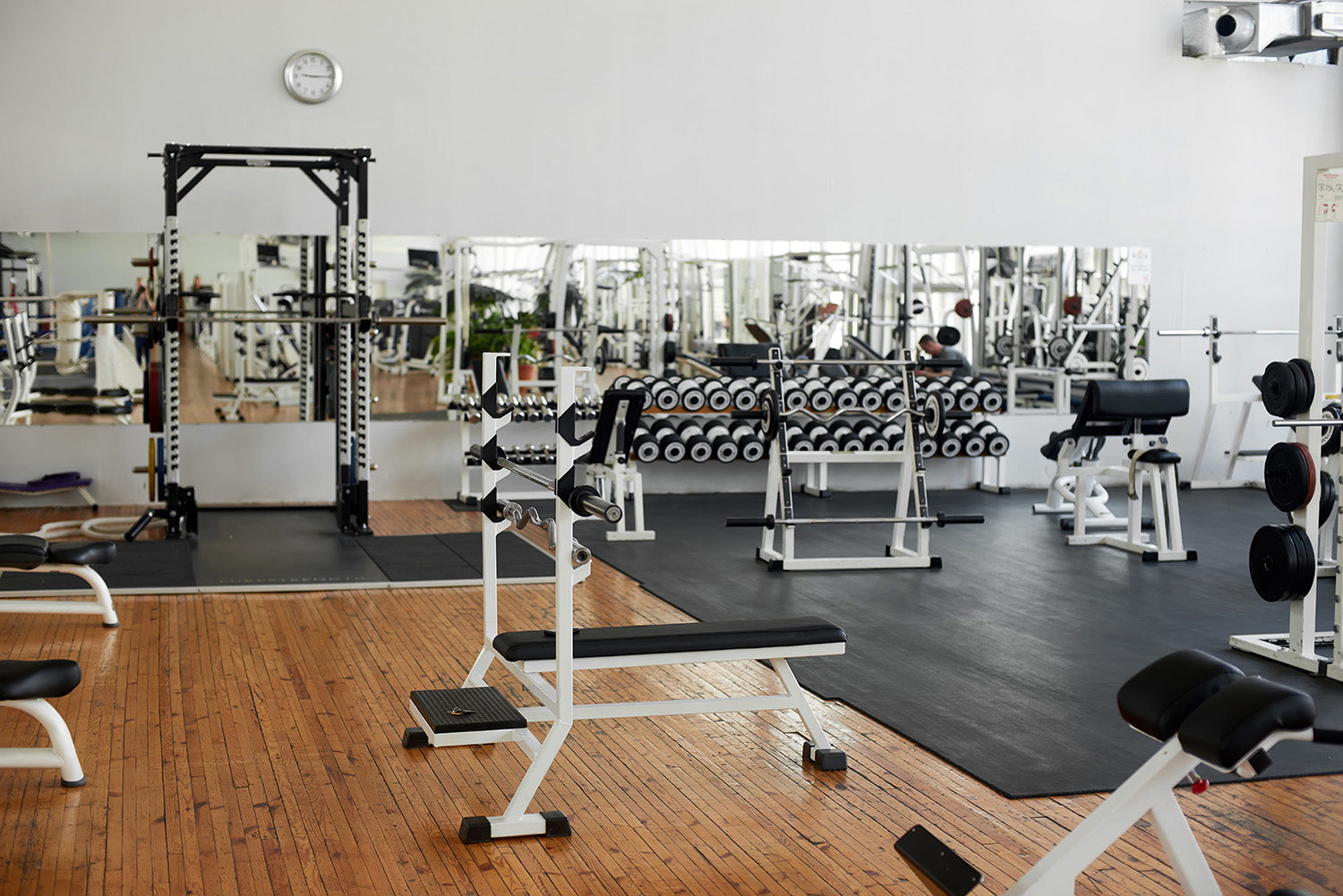 Modern fitness center with training equipment.
